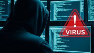 Eine Person mit Kaputzenpulli sitzt vor vielen Bildschirmen. Roter Hinweis Virus